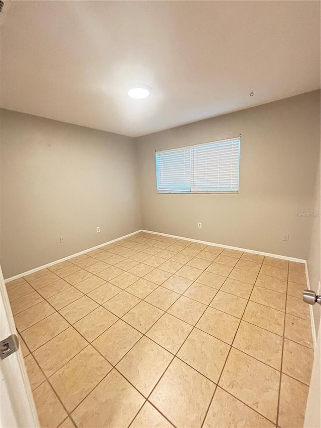 empty room featuring light tile patterned floors