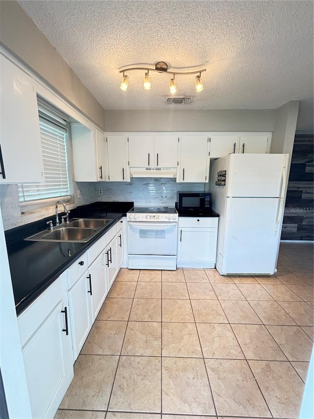 kitchen featuring white cabinetry, white appliances, light tile patterned flooring, a textured ceiling, and sink