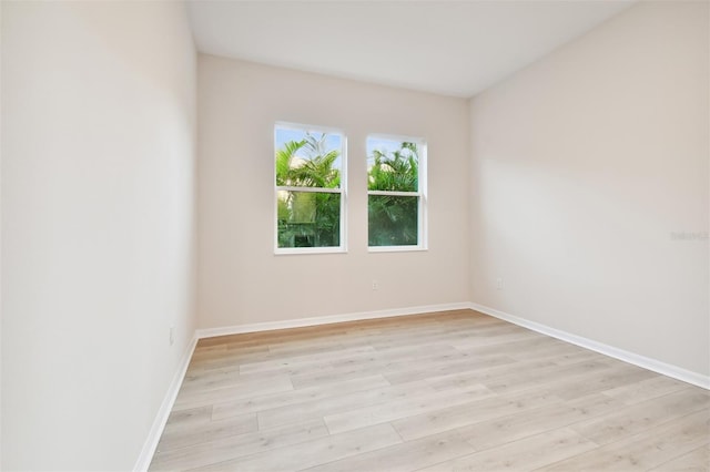 spare room featuring light hardwood / wood-style floors