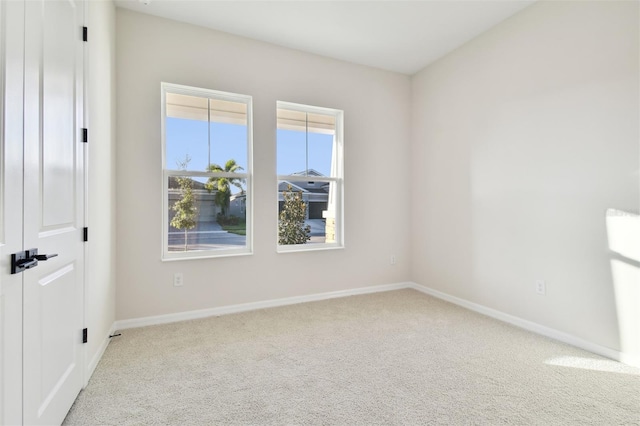 empty room featuring light carpet