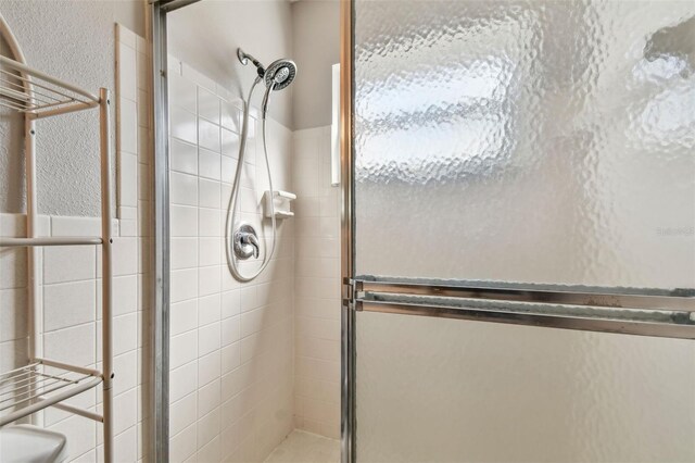 bathroom with an enclosed shower