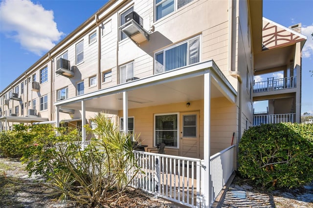 exterior space featuring a porch and central AC