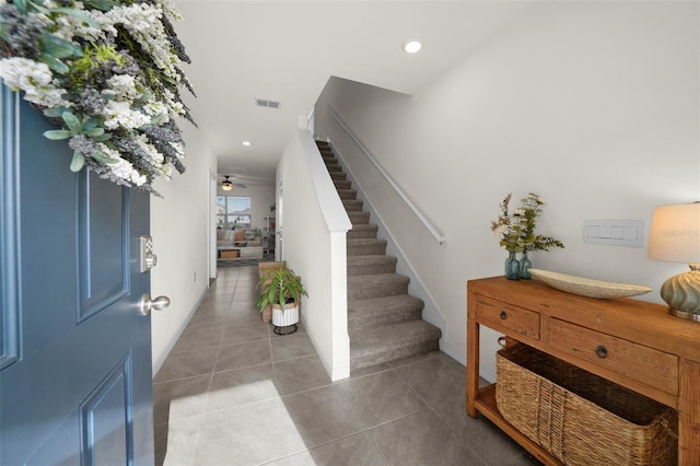 tiled entrance foyer featuring ceiling fan