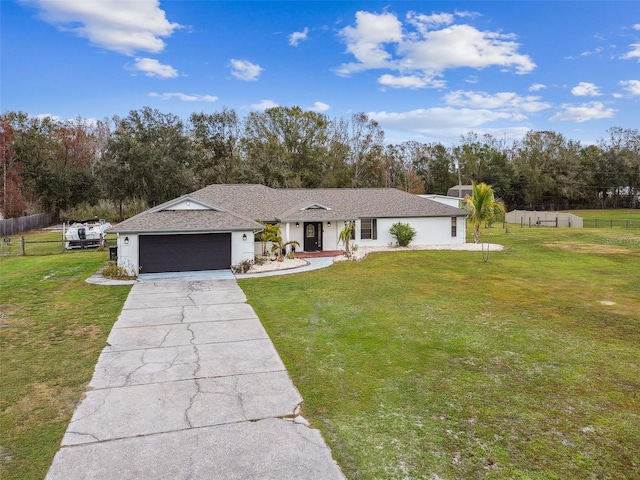 ranch-style home featuring a front yard and a garage