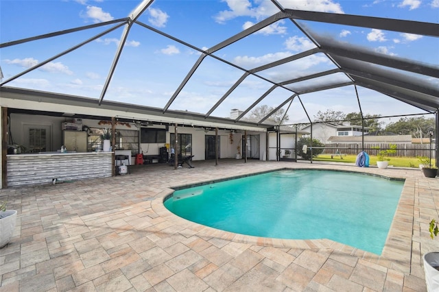 view of pool with a patio area, a lanai, and ceiling fan