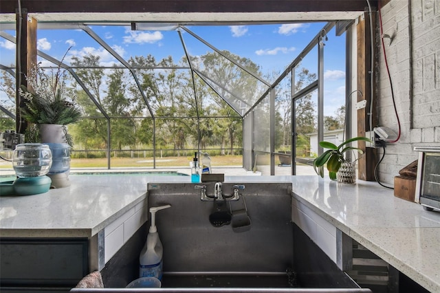 view of patio with a lanai and exterior bar