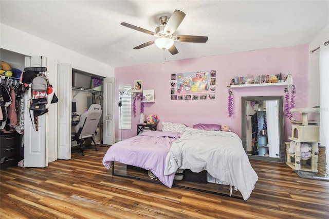 bedroom with ceiling fan and dark hardwood / wood-style flooring