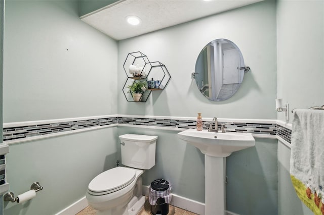 bathroom with toilet and sink