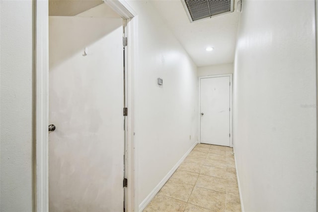 corridor featuring light tile patterned floors