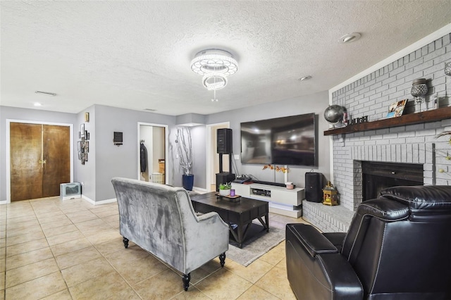 living room featuring a textured ceiling, a brick fireplace, and light tile patterned floors