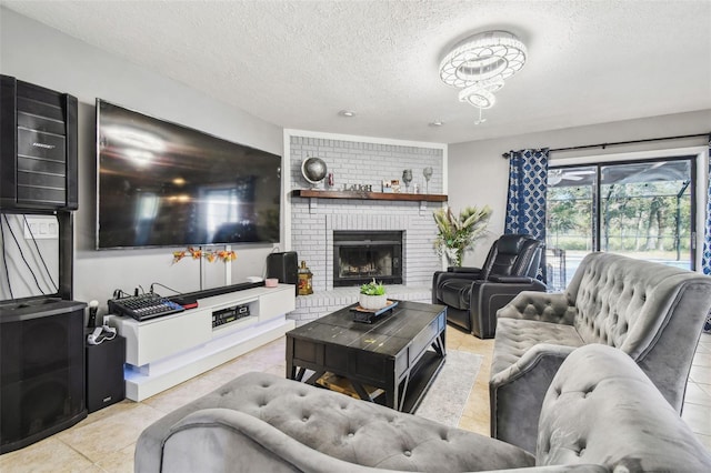 living room featuring a brick fireplace, a textured ceiling, and light tile patterned flooring