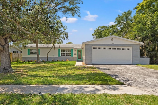 single story home featuring a front yard and a garage