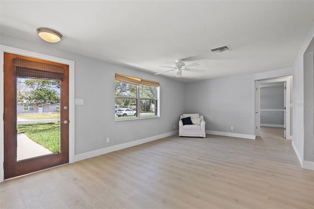 unfurnished room featuring ceiling fan and light hardwood / wood-style flooring