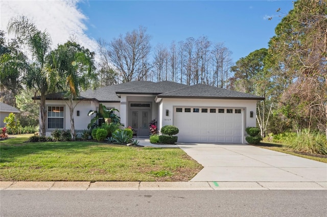 view of front of house with a garage and a front yard