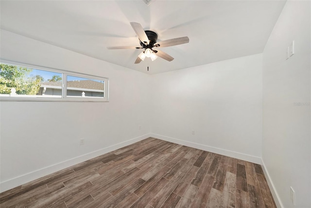 spare room featuring wood-type flooring and ceiling fan