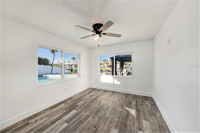 empty room featuring wood-type flooring and ceiling fan