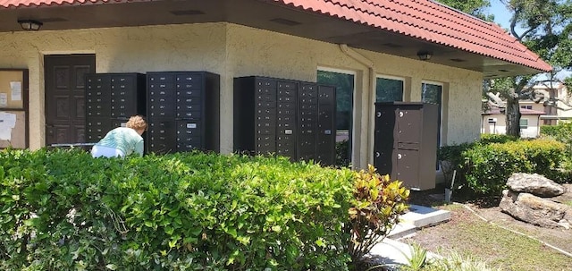 view of home's community featuring mail boxes