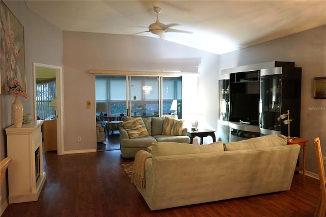 living room featuring vaulted ceiling, ceiling fan, and dark hardwood / wood-style flooring