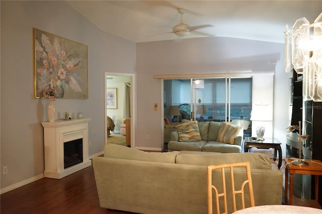 living room with dark wood-type flooring, lofted ceiling, and ceiling fan