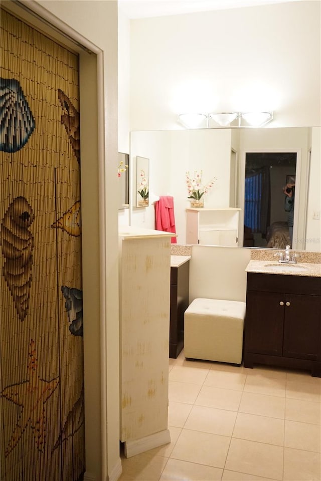 bathroom with tile patterned flooring and vanity