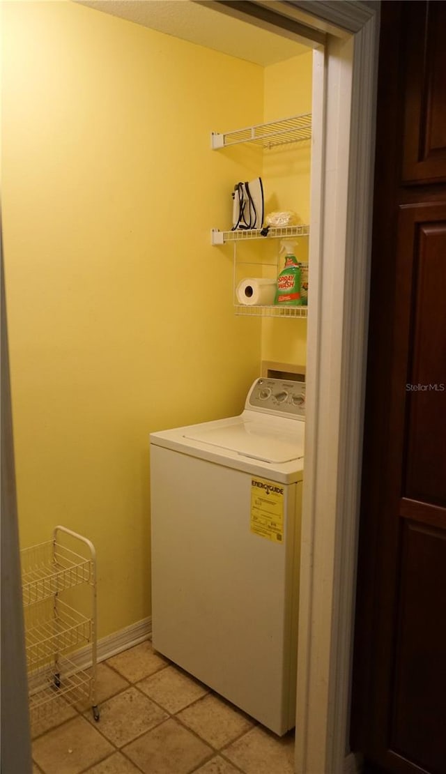 washroom featuring light tile patterned floors and washer / clothes dryer