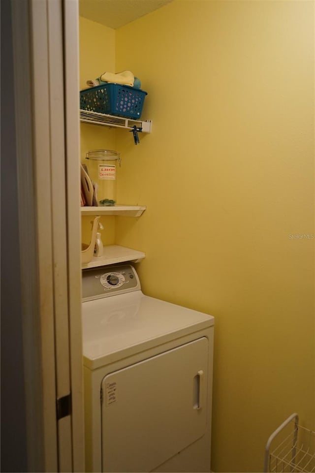 laundry area with washer / dryer