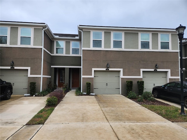 multi unit property featuring a garage