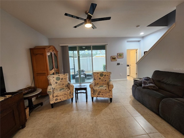 living room featuring ceiling fan and light tile patterned flooring