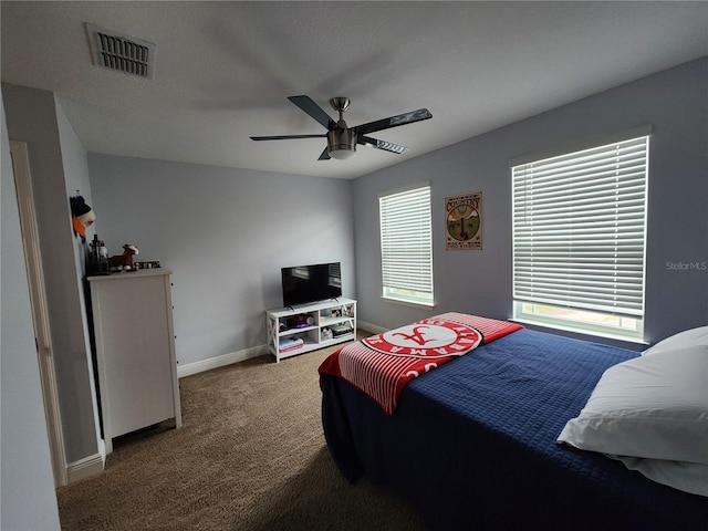 bedroom with ceiling fan and carpet flooring