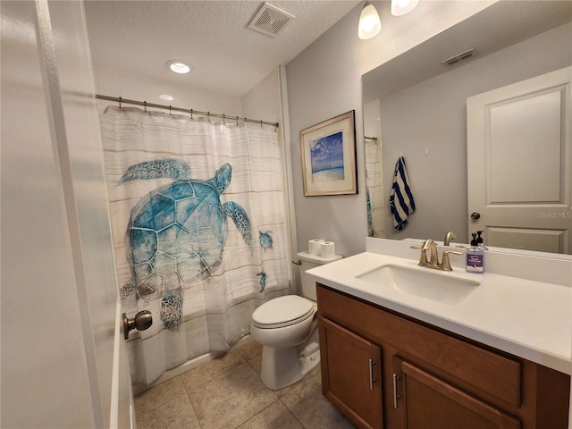 bathroom with a textured ceiling, toilet, vanity, and walk in shower