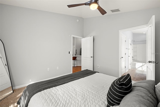 7001 Interbay Blvd Unit 313, Tampa, FL 33616 - bedroom with visible vents, baseboards, ceiling fan, and vaulted ceiling