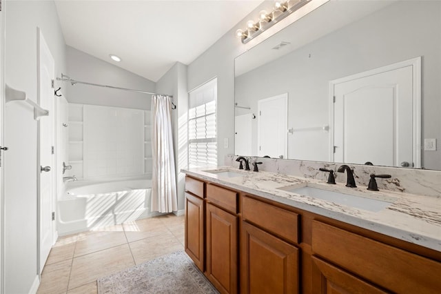 7001 Interbay Blvd Unit 313, Tampa, FL 33616 - bathroom with double vanity, a sink, shower / tub combo with curtain, and vaulted ceiling
