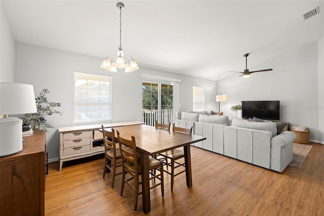 7001 Interbay Blvd Unit 313, Tampa, FL 33616 - dining room with a chandelier, light wood-style floors, a ceiling fan, and lofted ceiling