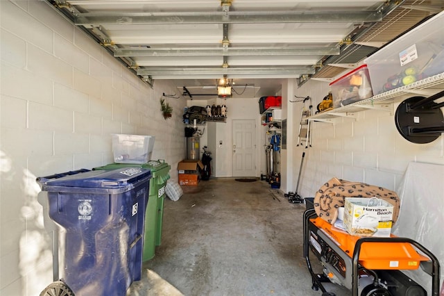 7001 Interbay Blvd Unit 313, Tampa, FL 33616 - garage featuring a garage door opener and concrete block wall