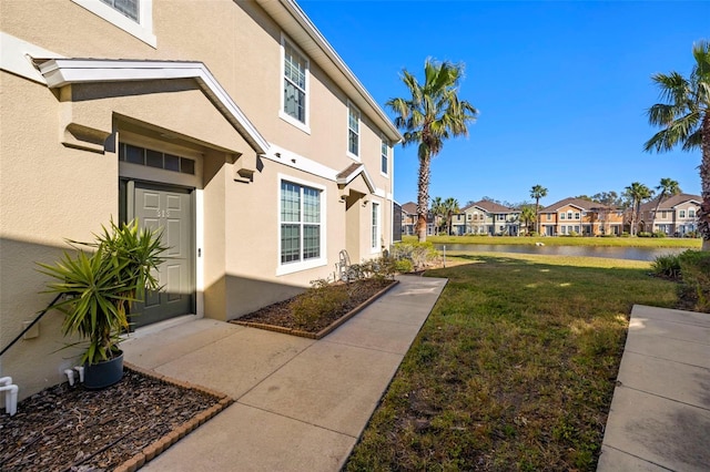 7001 Interbay Blvd Unit 313, Tampa, FL 33616 - view of green lawn featuring a water view and a residential view