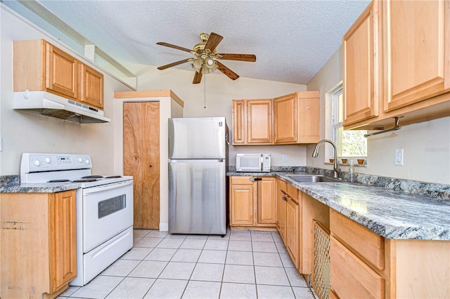 kitchen featuring ceiling fan, sink, a textured ceiling, white appliances, and light tile patterned floors