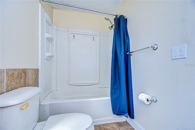 bathroom featuring tile patterned floors and toilet