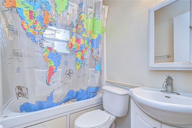 full bathroom with vanity, toilet, and shower / tub combo