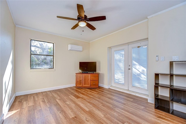 unfurnished living room with light hardwood / wood-style floors, crown molding, a wall unit AC, and french doors