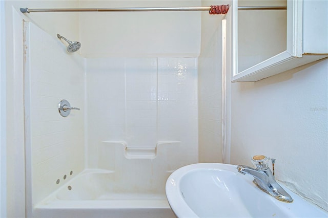 bathroom featuring sink and shower / bathing tub combination