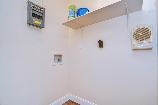 washroom with wood finished floors, baseboards, laundry area, and hookup for a washing machine