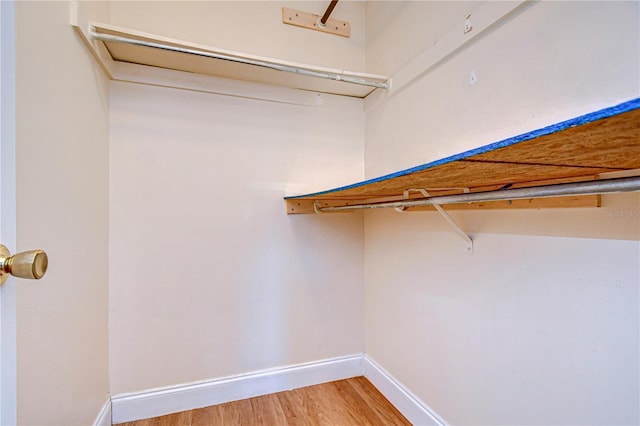 walk in closet featuring light wood-style floors