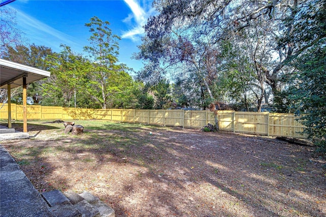 view of yard with a fenced backyard