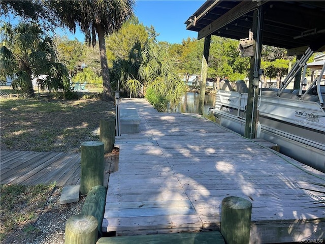 dock area featuring a water view