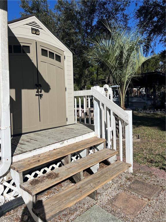 deck with a storage shed