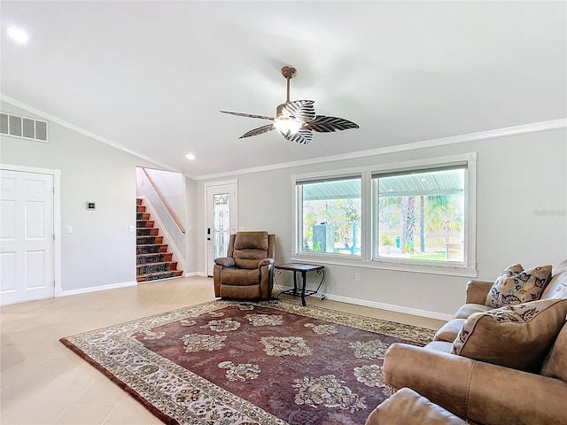 living room featuring ceiling fan, crown molding, and lofted ceiling