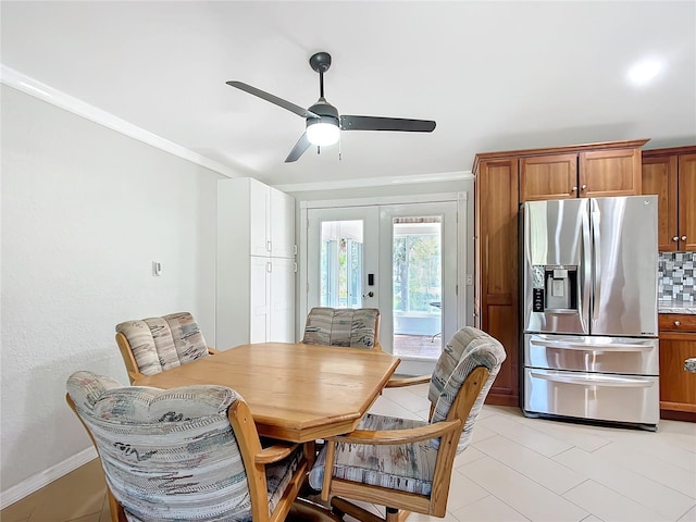 dining space with french doors, ceiling fan, and ornamental molding