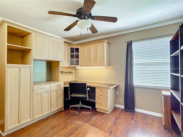 office space featuring light wood-type flooring, crown molding, and ceiling fan