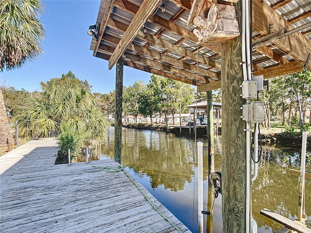 dock area with a water view