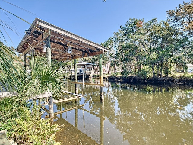 dock area featuring a water view